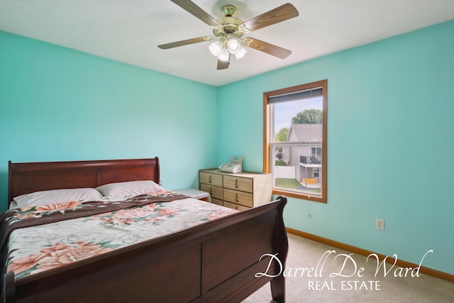 5512 Lillyview Ave SW, Wyoming, MI 49509 - bedroom with baseboards, light colored carpet, and a ceiling fan