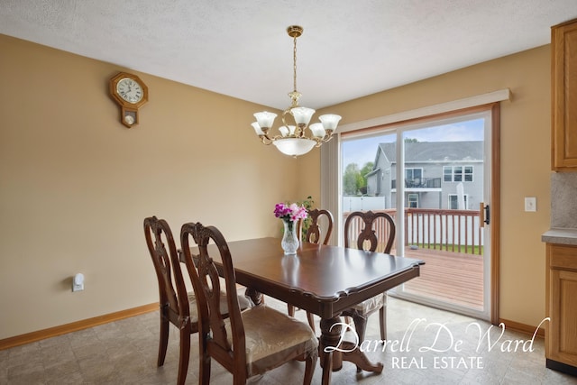 5512 Lillyview Ave SW, Wyoming, MI 49509 - dining room featuring a chandelier and baseboards