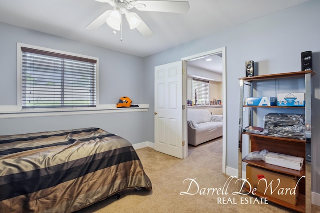 5512 Lillyview Ave SW, Wyoming, MI 49509 - carpeted bedroom featuring a ceiling fan and baseboards