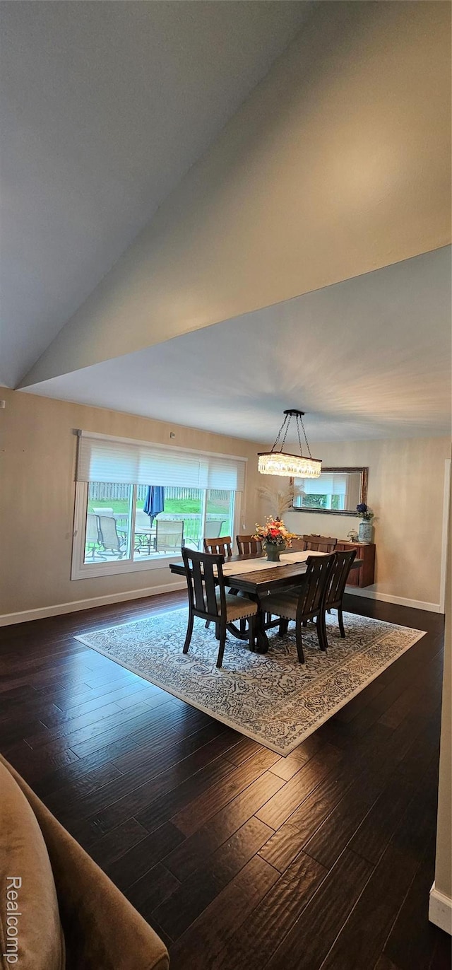 5084 Champlain Cir W, Bloomfield, MI 48323 - dining room with healthy amount of natural light, baseboards, wood-type flooring, and vaulted ceiling
