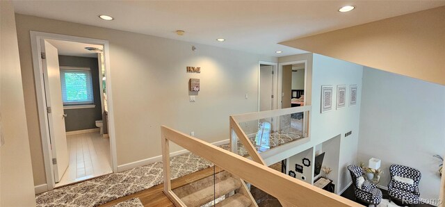 5084 Champlain Cir W, Bloomfield, MI 48323 - hallway with an upstairs landing, recessed lighting, baseboards, and wood finished floors