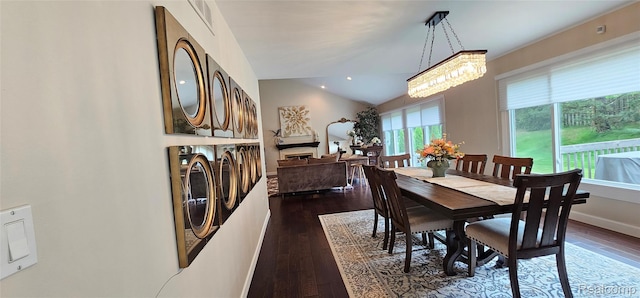 5084 Champlain Cir W, Bloomfield, MI 48323 - dining room with dark wood-style flooring, a chandelier, lofted ceiling, and baseboards