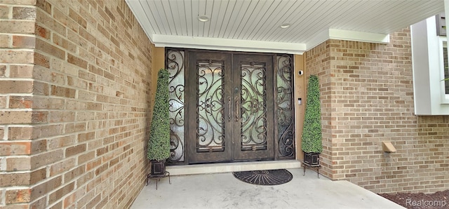 5084 Champlain Cir W, Bloomfield, MI 48323 - property entrance featuring french doors and brick siding