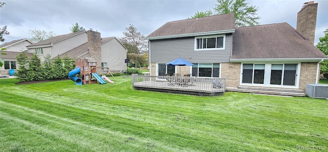 5084 Champlain Cir W, Bloomfield, MI 48323 - rear view of house with a playground, central air condition unit, brick siding, a chimney, and a lawn