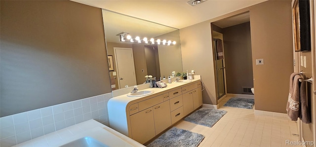 5084 Champlain Cir W, Bloomfield, MI 48323 - bathroom featuring double vanity, tile patterned flooring, a stall shower, a garden tub, and toilet