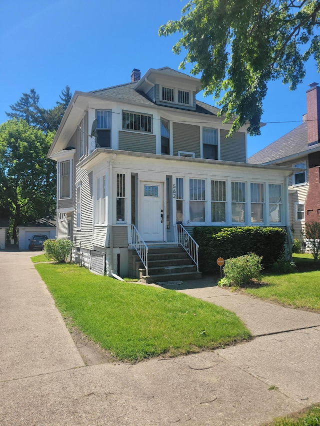 562 Columbus Ave, Benton Harbor, MI 49022 - traditional style home featuring a front lawn and a chimney