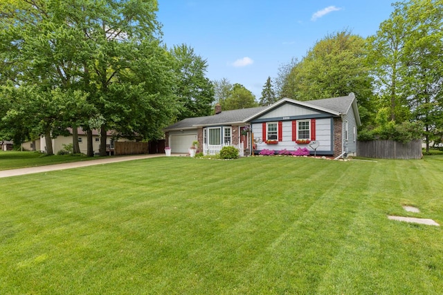 4239 Glen Hollow Dr, Hudsonville, MI 49426 - ranch-style home featuring a garage, concrete driveway, and a chimney
