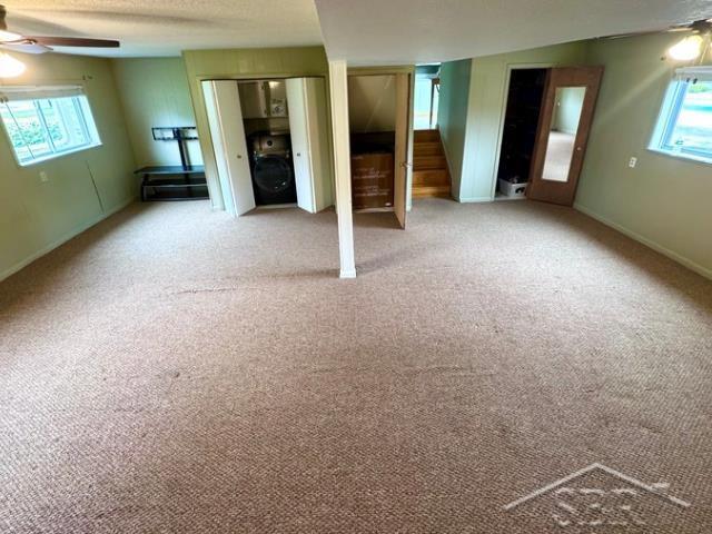 7200 Danny Dr, Saginaw, MI 48609 - unfurnished bedroom featuring carpet flooring, multiple closets, and baseboards