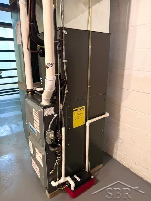7200 Danny Dr, Saginaw, MI 48609 - utility room featuring heating unit