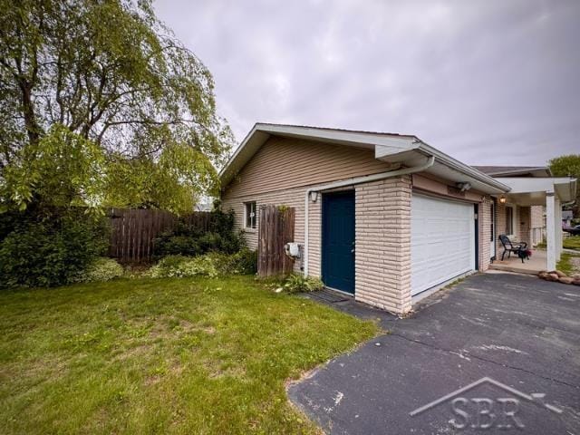 7200 Danny Dr, Saginaw, MI 48609 - garage with asphalt driveway