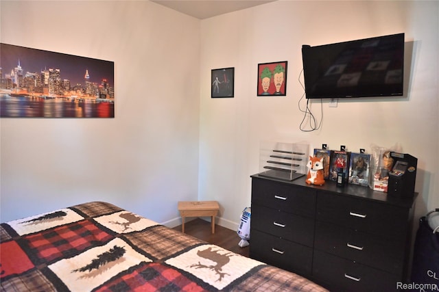 23744 Liddle St, Brownstown, MI 48183 - bedroom with baseboards and dark wood-style floors
