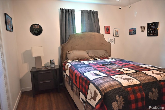 23744 Liddle St, Brownstown, MI 48183 - bedroom with dark wood-type flooring and baseboards