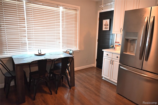 23744 Liddle St, Brownstown, MI 48183 - dining room featuring baseboards and dark wood-type flooring