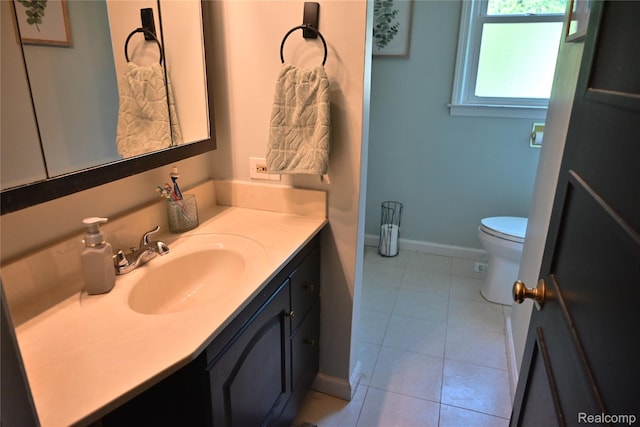 23744 Liddle St, Brownstown, MI 48183 - bathroom featuring vanity, toilet, tile patterned floors, and baseboards