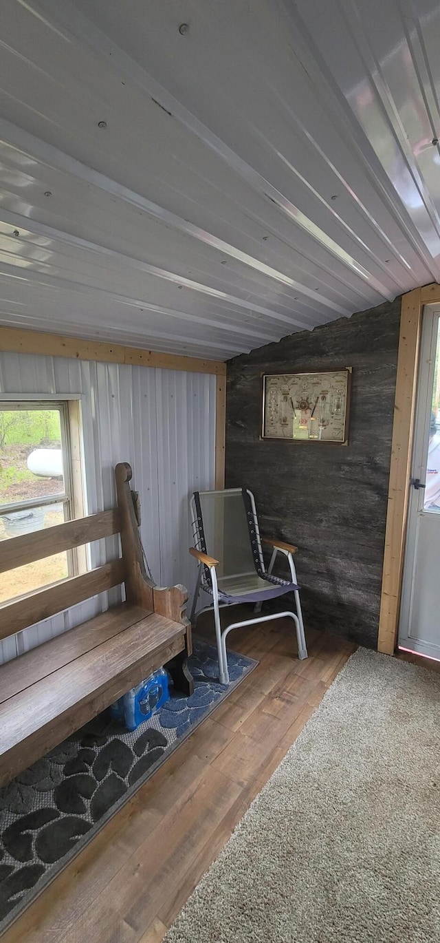 11384 N Irons Rd, Irons, MI 49644 - sitting room featuring wooden walls and wood-type flooring