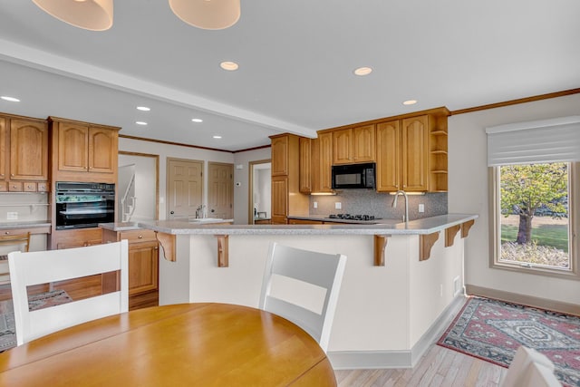 1780 Williamsburg Dr, Adrian, MI 49221 - kitchen with black appliances, backsplash, open shelves, light wood-style floors, and recessed lighting