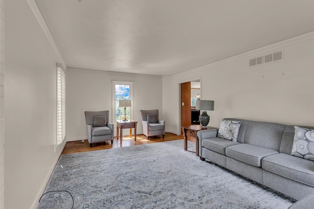 1780 Williamsburg Dr, Adrian, MI 49221 - living area featuring ornamental molding, wood finished floors, and baseboards