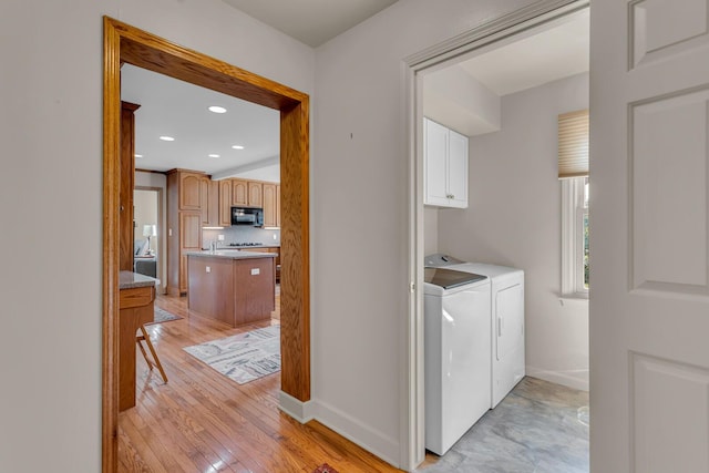 1780 Williamsburg Dr, Adrian, MI 49221 - laundry room featuring washer and dryer, cabinet space, baseboards, light wood-type flooring, and recessed lighting