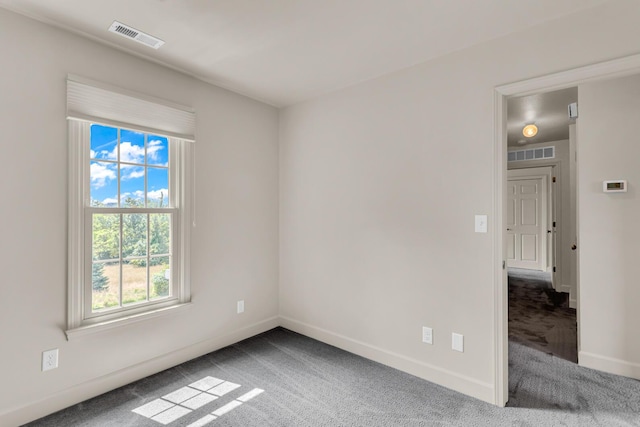 1780 Williamsburg Dr, Adrian, MI 49221 - spare room featuring carpet flooring and baseboards