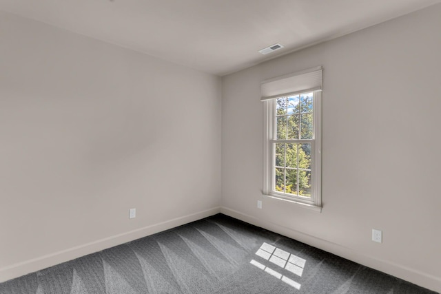 1780 Williamsburg Dr, Adrian, MI 49221 - spare room featuring baseboards and dark carpet