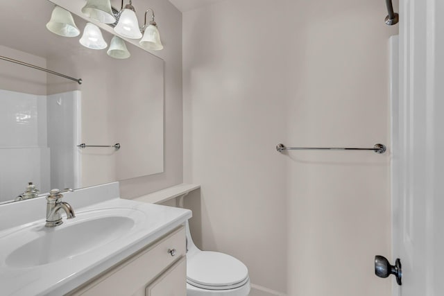 1780 Williamsburg Dr, Adrian, MI 49221 - full bath with vanity, toilet, a shower, and baseboards