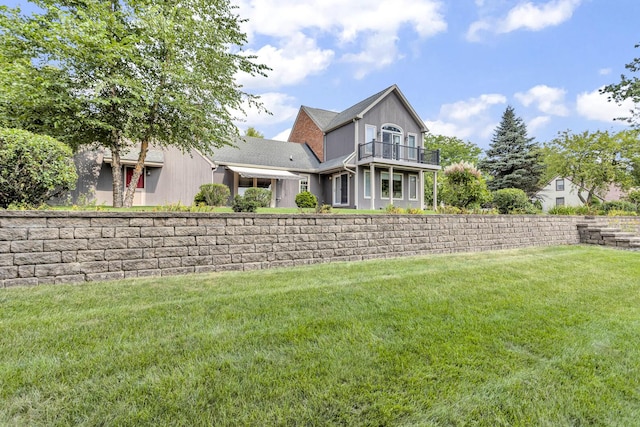 1780 Williamsburg Dr, Adrian, MI 49221 - rear view of house featuring a balcony and a yard