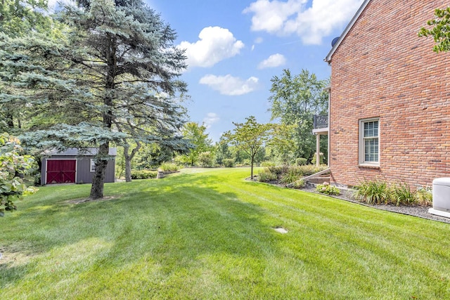 1780 Williamsburg Dr, Adrian, MI 49221 - view of grassy yard with a balcony and an outdoor structure