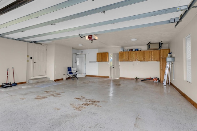 1780 Williamsburg Dr, Adrian, MI 49221 - garage featuring a garage door opener and baseboards