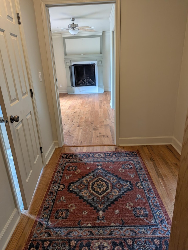 1780 Williamsburg Dr, Adrian, MI 49221 - hallway with wood finished floors, baseboards, and crown molding