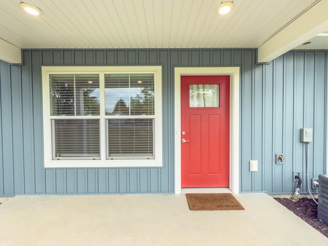 12773 Felch St, Holland, MI 49424 - view of exterior entry featuring board and batten siding and covered porch
