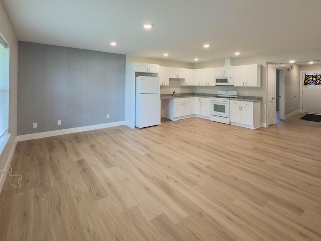 12773 Felch St, Holland, MI 49424 - kitchen featuring white appliances, baseboards, recessed lighting, white cabinetry, and open floor plan