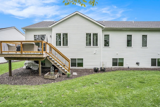 6617 Sheldon Crossing Dr, Hudsonville, MI 49426 - rear view of property featuring a deck, a lawn, stairway, and roof with shingles