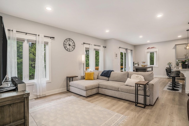 6617 Sheldon Crossing Dr, Hudsonville, MI 49426 - living area with plenty of natural light, light wood-style floors, recessed lighting, and baseboards