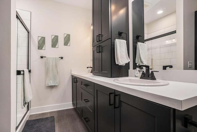6617 Sheldon Crossing Dr, Hudsonville, MI 49426 - full bath with baseboards, a shower stall, double vanity, and recessed lighting