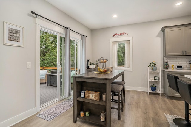 6617 Sheldon Crossing Dr, Hudsonville, MI 49426 - dining space featuring light wood finished floors, healthy amount of natural light, recessed lighting, and baseboards
