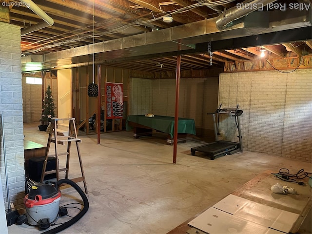 4440 Colby Ct, Burton, MI 48519 - unfinished below grade area featuring brick wall