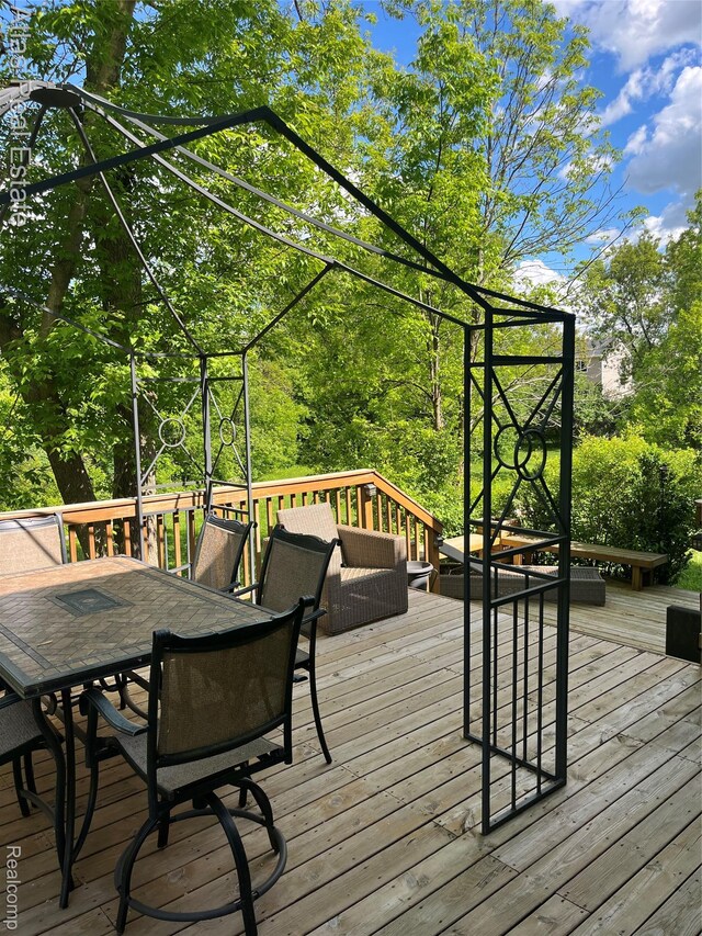 4440 Colby Ct, Burton, MI 48519 - deck featuring outdoor dining space