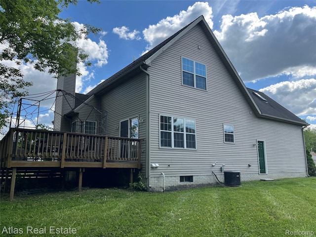 4440 Colby Ct, Burton, MI 48519 - back of property with a deck, a yard, central AC unit, and a chimney