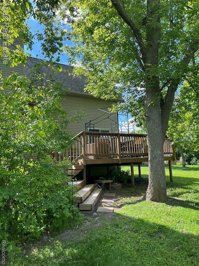 4440 Colby Ct, Burton, MI 48519 - view of green lawn with a wooden deck