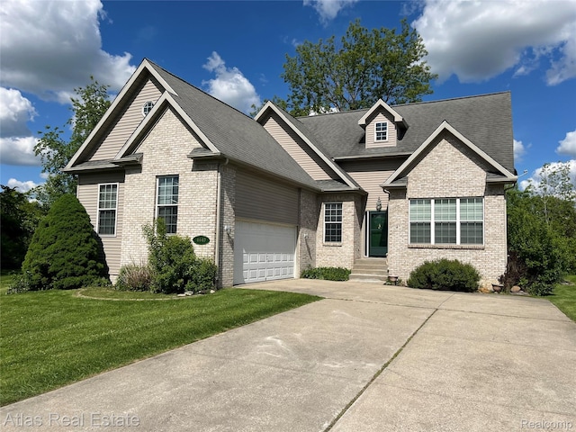 4440 Colby Ct, Burton, MI 48519 - view of front of property featuring brick siding, driveway, a front lawn, an attached garage, and roof with shingles