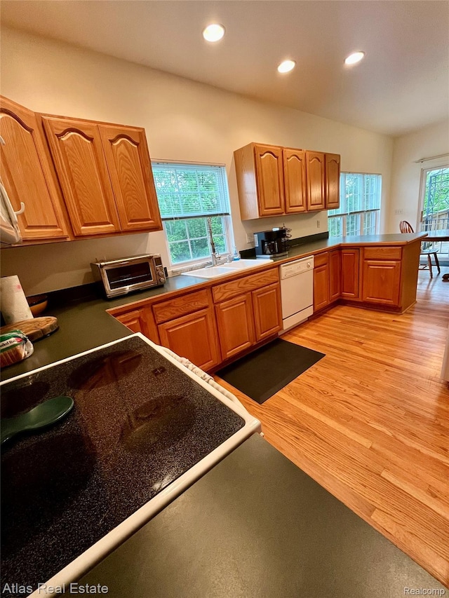 4440 Colby Ct, Burton, MI 48519 - kitchen featuring white dishwasher, recessed lighting, light wood finished floors, and a sink