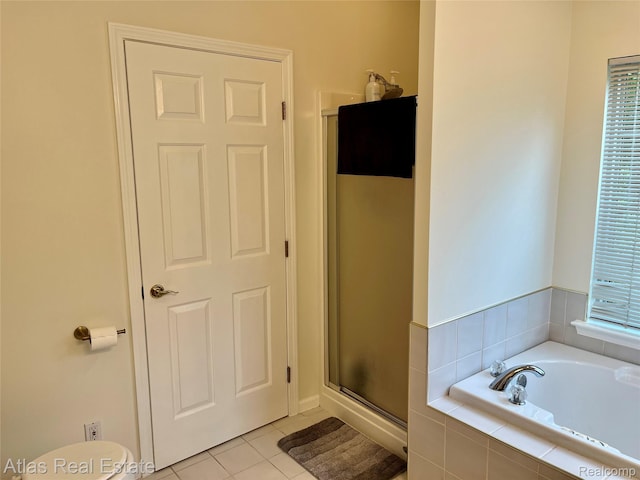 4440 Colby Ct, Burton, MI 48519 - full bath with a shower stall, a garden tub, tile patterned flooring, and toilet