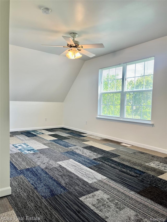 4440 Colby Ct, Burton, MI 48519 - bonus room with carpet flooring, a ceiling fan, vaulted ceiling, and baseboards