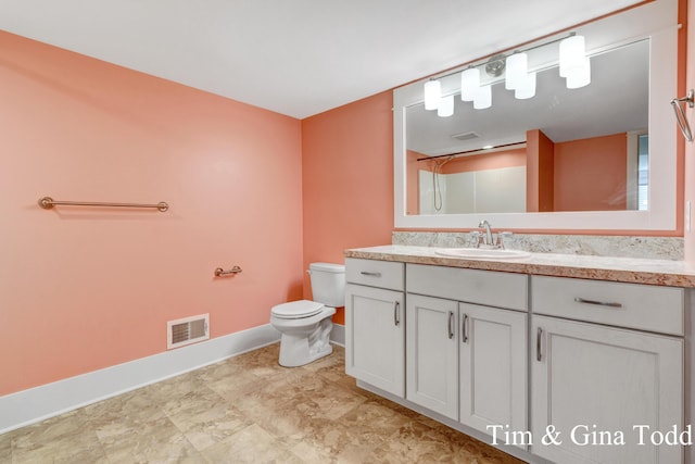 903 S Center Park Dr SW Unit 14, Byron Center, MI 49315 - bathroom featuring baseboards, vanity, and toilet