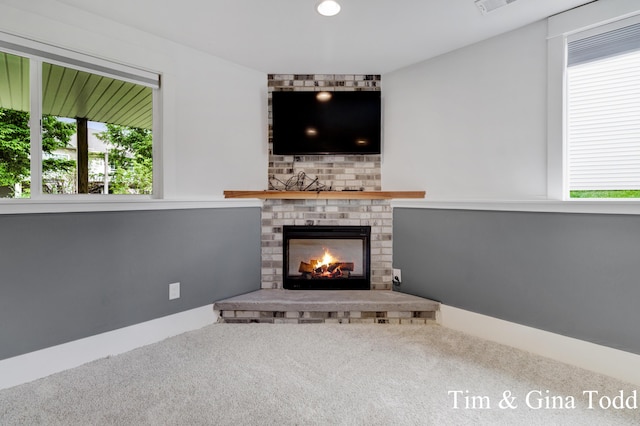 903 S Center Park Dr SW Unit 14, Byron Center, MI 49315 - unfurnished living room with a fireplace, carpet, and recessed lighting