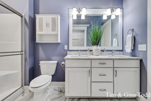 903 S Center Park Dr SW Unit 14, Byron Center, MI 49315 - bathroom with marble look tiles, toilet, double vanity, a shower stall, and baseboards