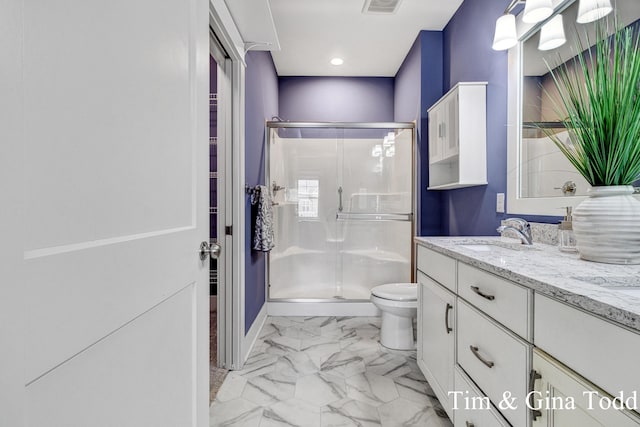 903 S Center Park Dr SW Unit 14, Byron Center, MI 49315 - bathroom featuring toilet, a stall shower, double vanity, marble look tile flooring, and recessed lighting