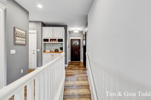 903 S Center Park Dr SW Unit 14, Byron Center, MI 49315 - stairs with wood finished floors, a barn door, and recessed lighting