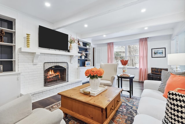 4396 Laurel Dr, Saint Joseph, MI 49085 - living room featuring beamed ceiling, a fireplace, wood finished floors, recessed lighting, and built in shelves