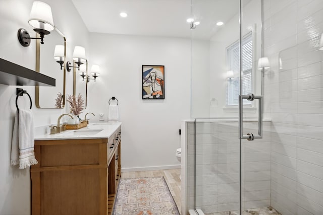 4396 Laurel Dr, Saint Joseph, MI 49085 - bathroom with double vanity, a stall shower, wood finished floors, toilet, and recessed lighting